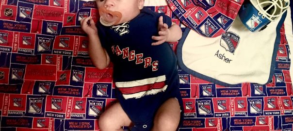 Asher cheers for New York Rangers