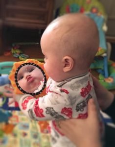 Asher sticks his tongue out when he focuses